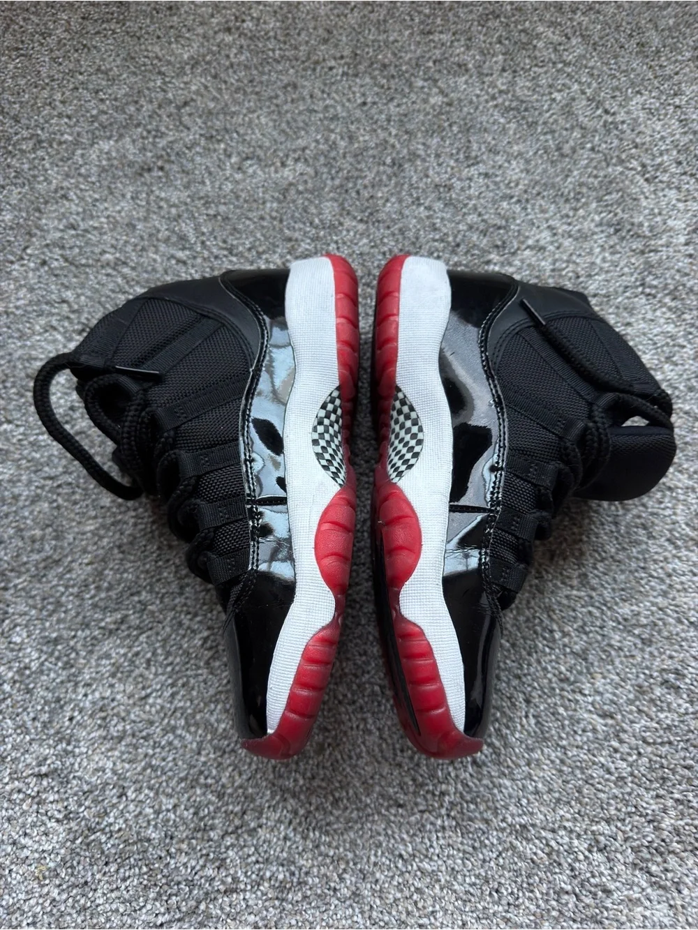 4.5Y Women’s 6 Jordan Bred 11s Black and Red High-Top Sneakers